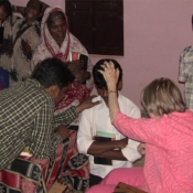 Sister Irene praying for the sick